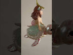 Mermaids riding sea animals